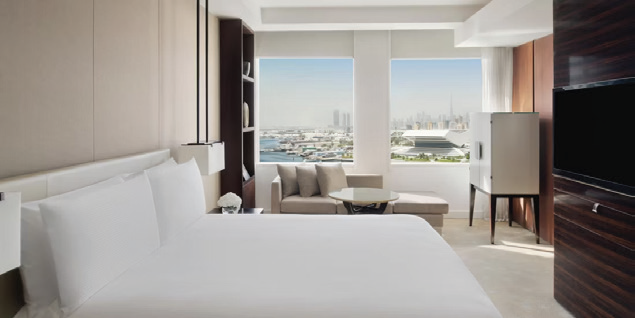 Guest room at InterContinental Dubai Festival City overlooking the Dubai skyline